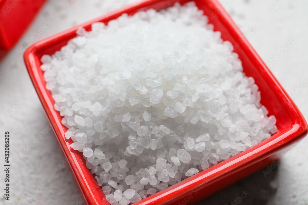 Bowl with salt on table, closeup