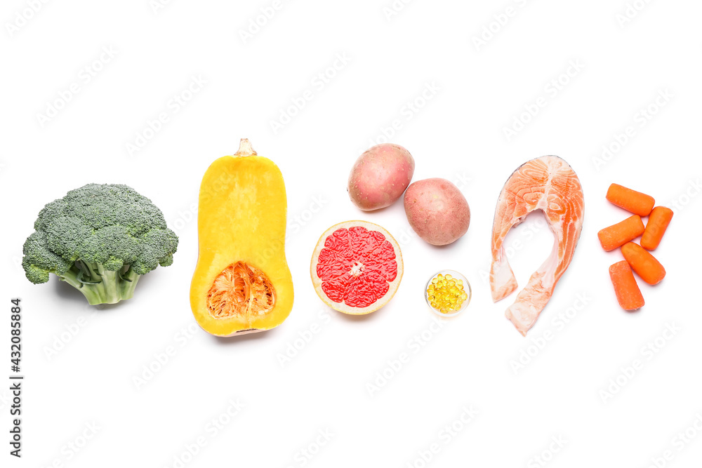 Healthy products with pills on white background