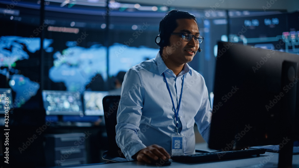 Portrait of Professional IT Technical Support Specialist Working on Computer in Monitoring Control R