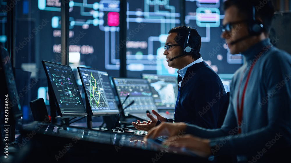 Portrait of Professional IT Technical Support Specialist Working on Computer in Monitoring Control R