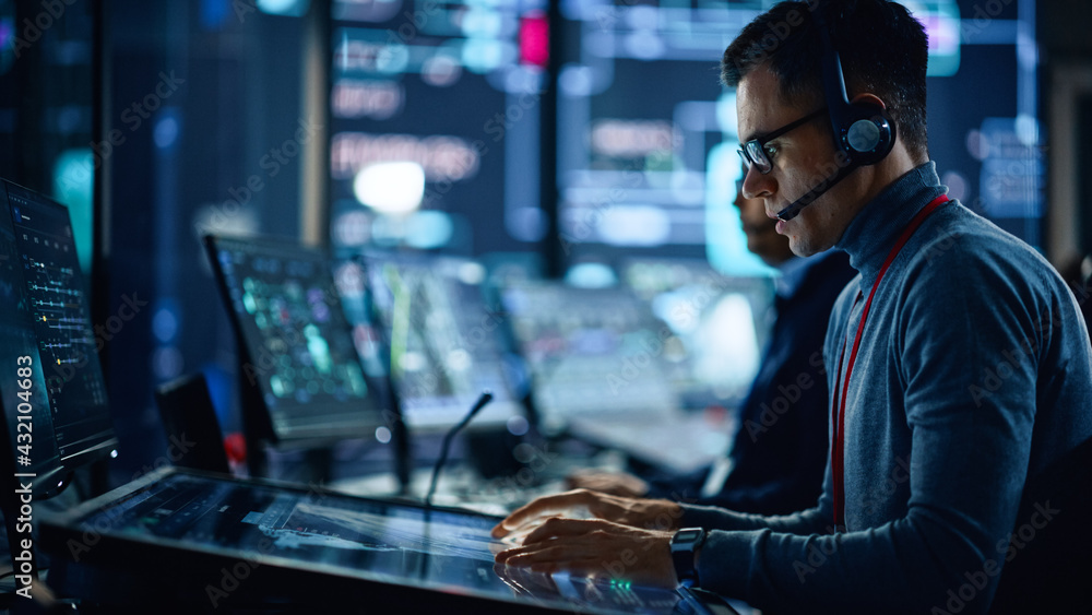 Portrait of Professional IT Technical Support Specialist Working on Computer in Monitoring Control R