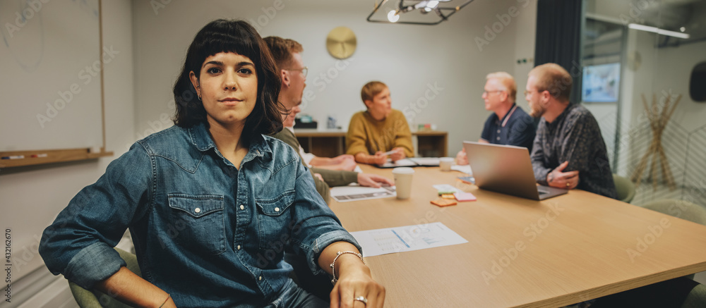 Woman sitting in meeting room