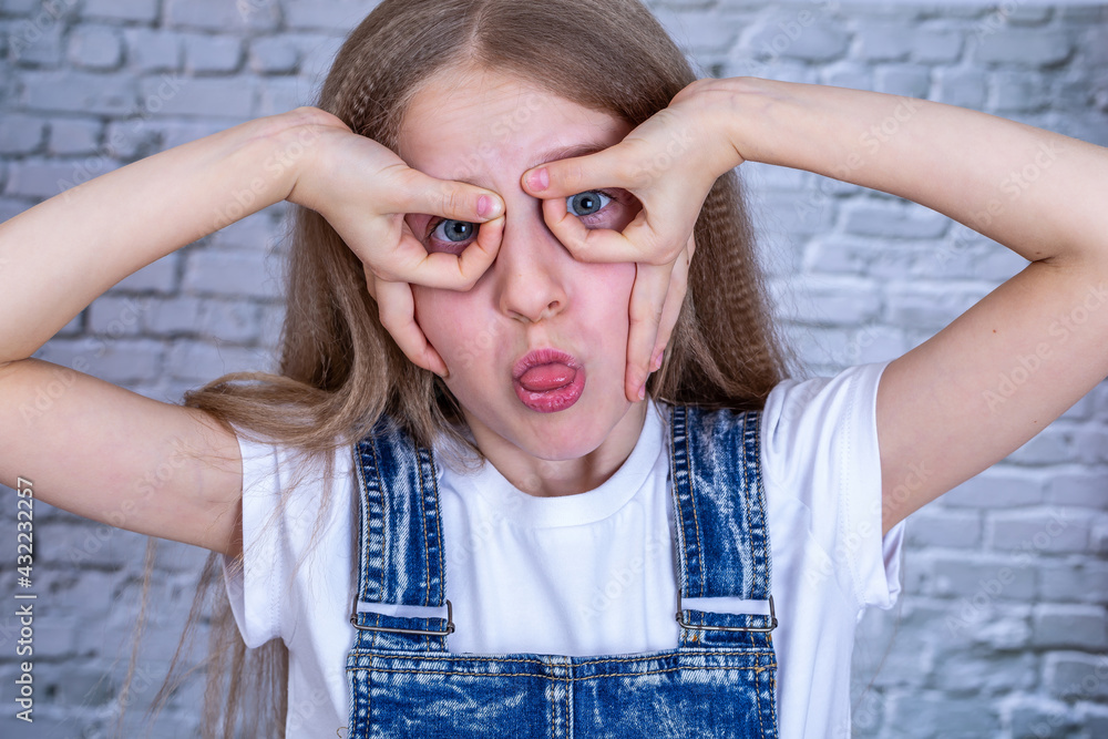 Fun girl shows glasses and look to the camera