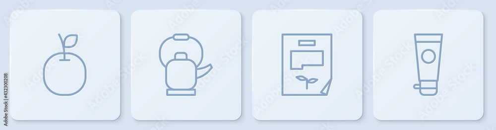 套装苹果、叶子文件、带手柄的水壶和奶油或乳液化妆品管。白色方形布