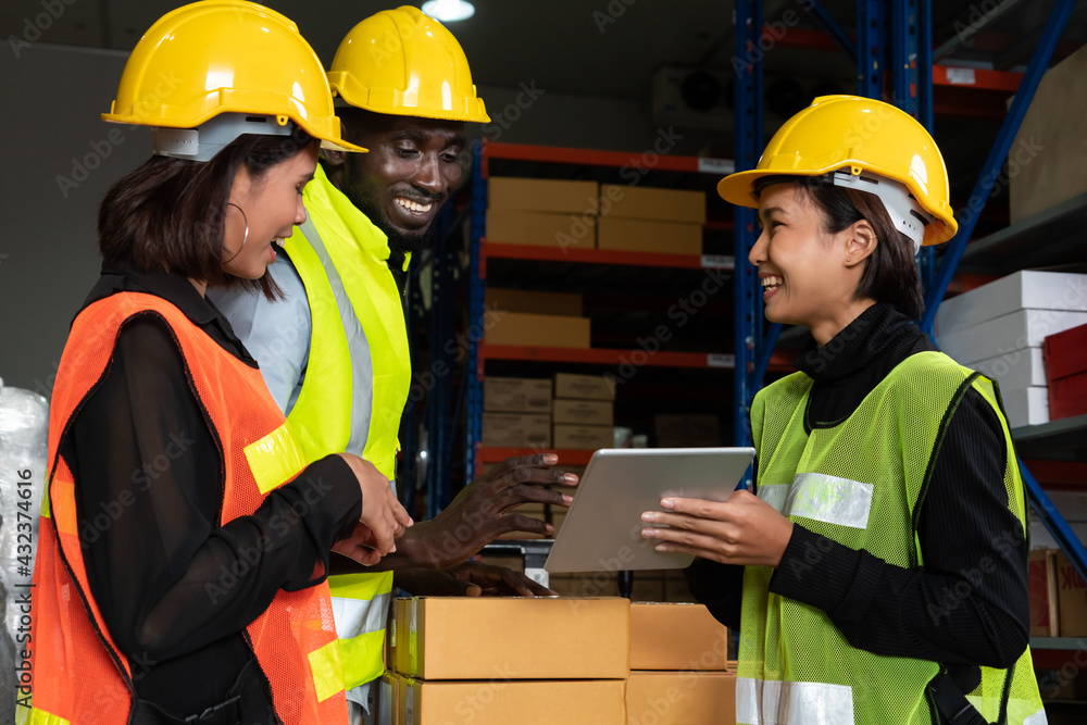 Warehouse worker working together in the storehouse . Logistics , supply chain and warehouse busines