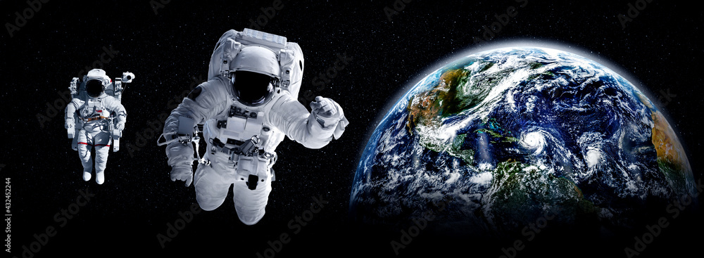 Astronaut spaceman do spacewalk while working for space station in outer space . Astronaut wear full