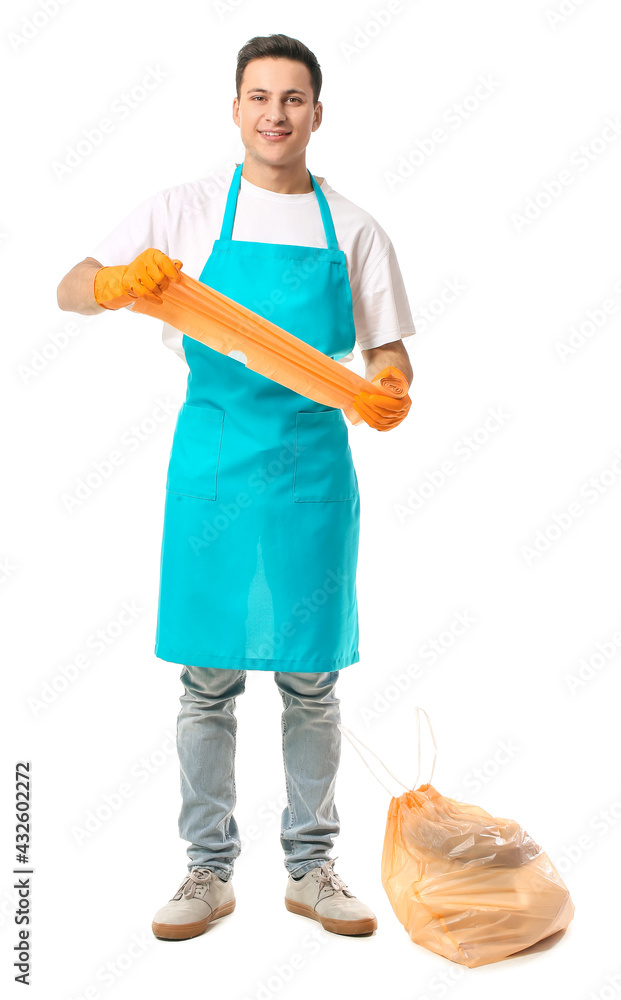 Male janitor with garbage bags on white background