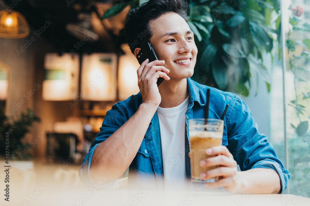 Young Asian man working at coffee shop