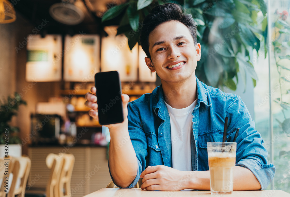 Young Asian man working at coffee shop