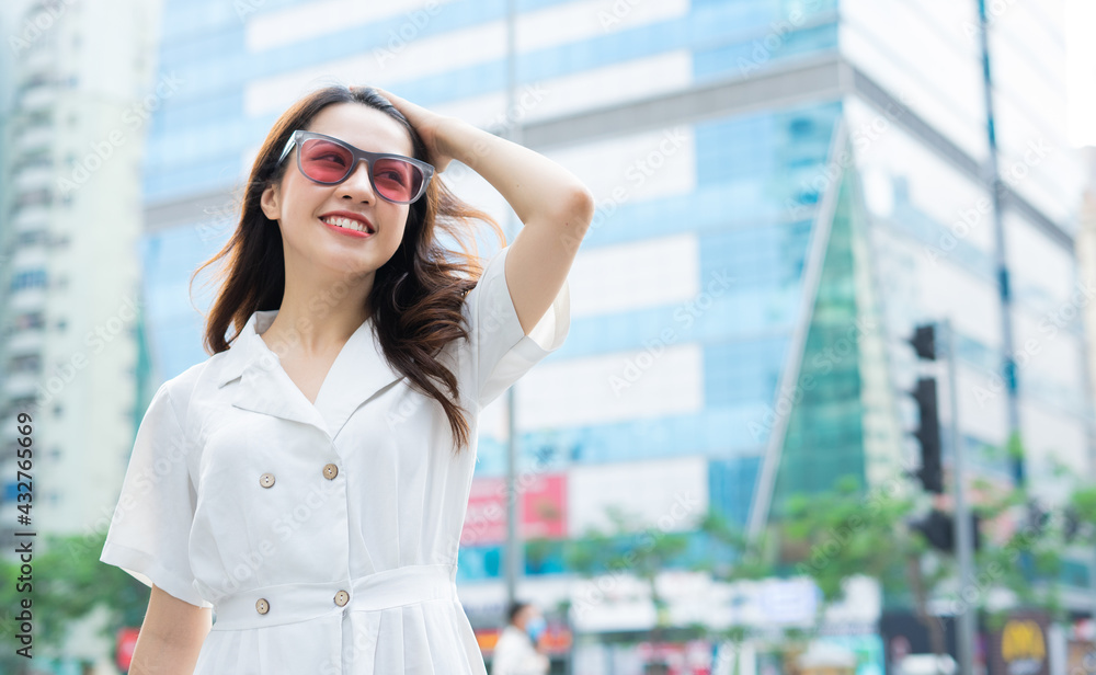 Young Asian woman walking on the street