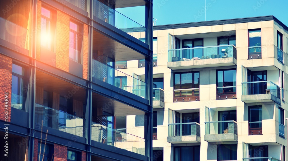 Architectural exterior detail of residential apartment building with brick facade. Modern brick and 