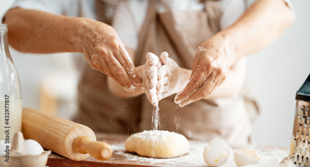 Hands preparing dough