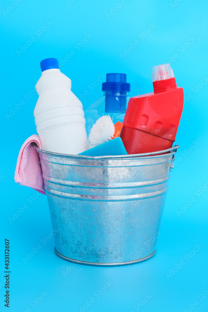 Set of cleaning supplies on color background