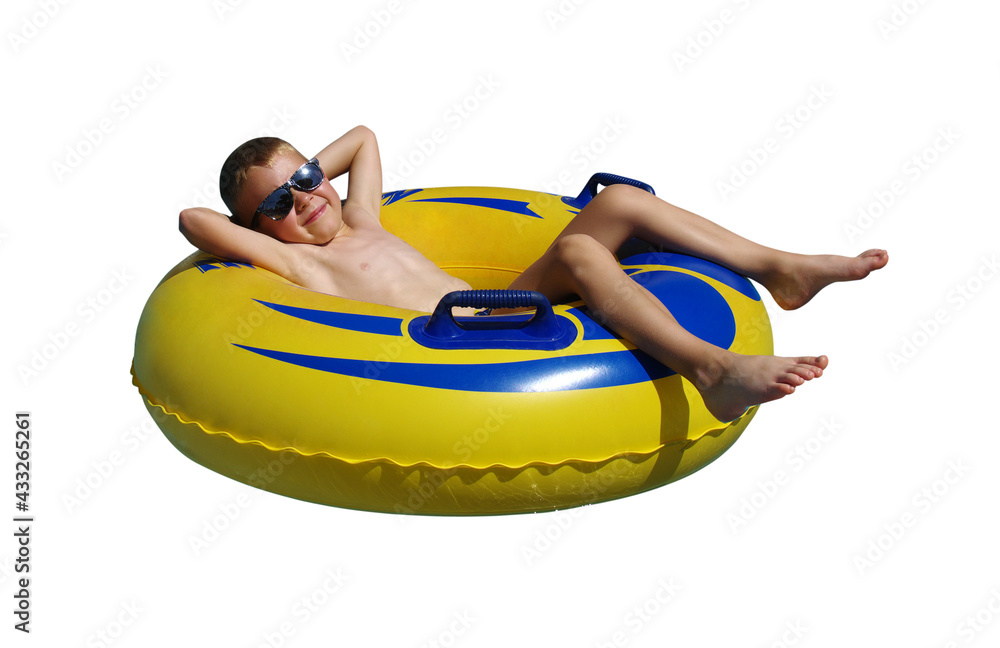 Boy on the inflatable ring isolated on white