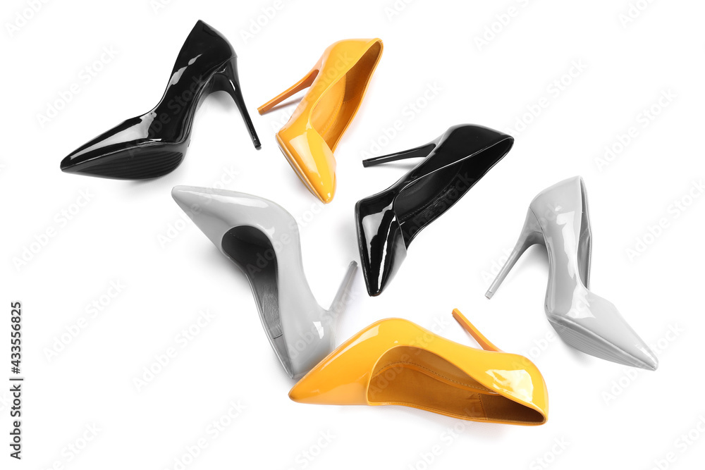 Different high heels on white background