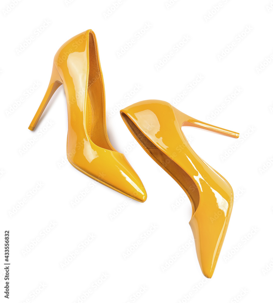 Pair of stylish high heels on white background