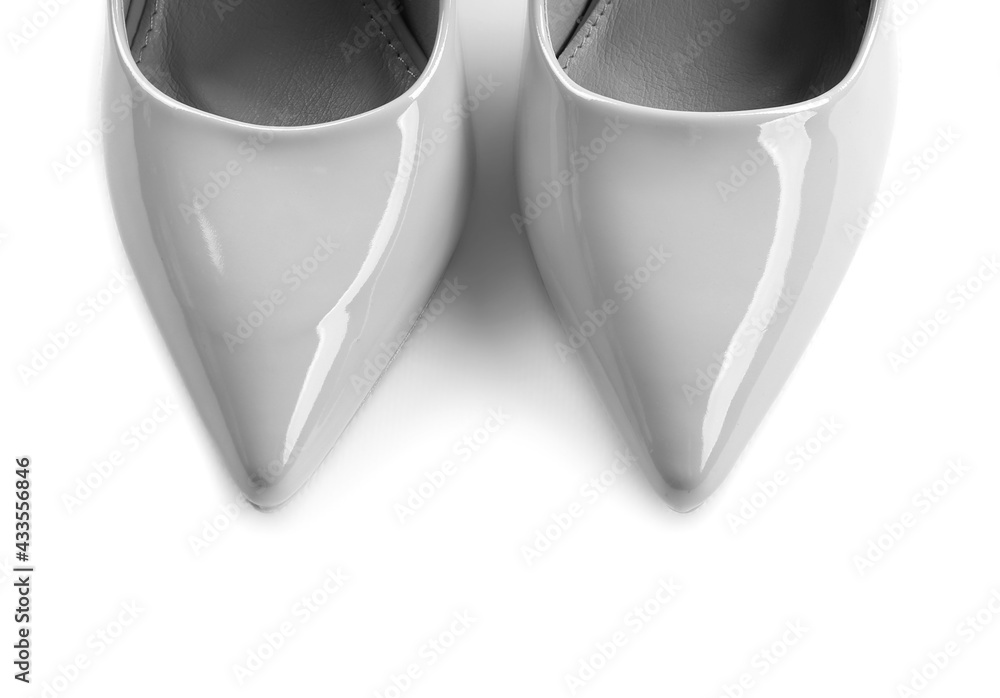 Pair of stylish high heels on white background