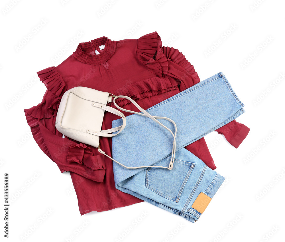 Stylish female clothes with accessories on white background