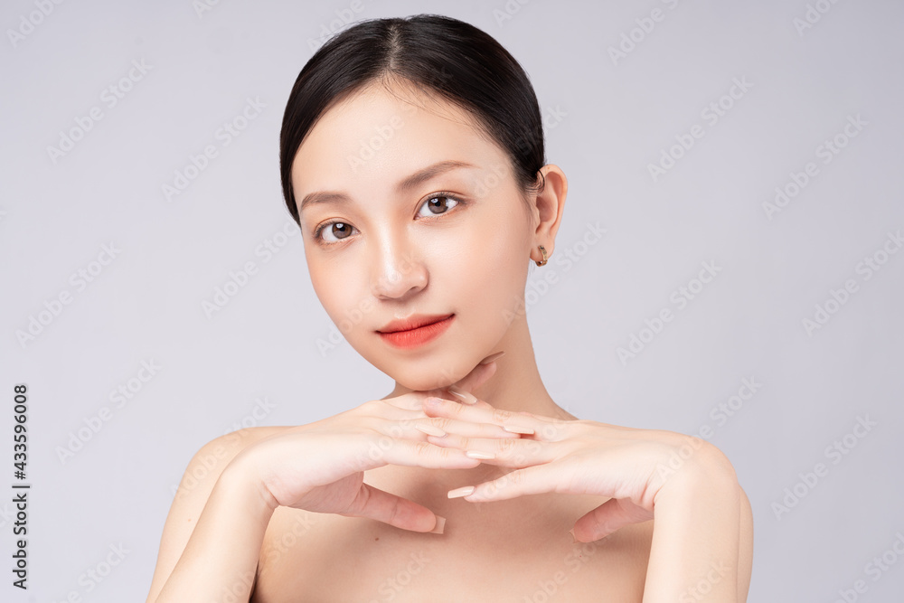 Beautiful Asian woman feels happy with beautiful healthy skin