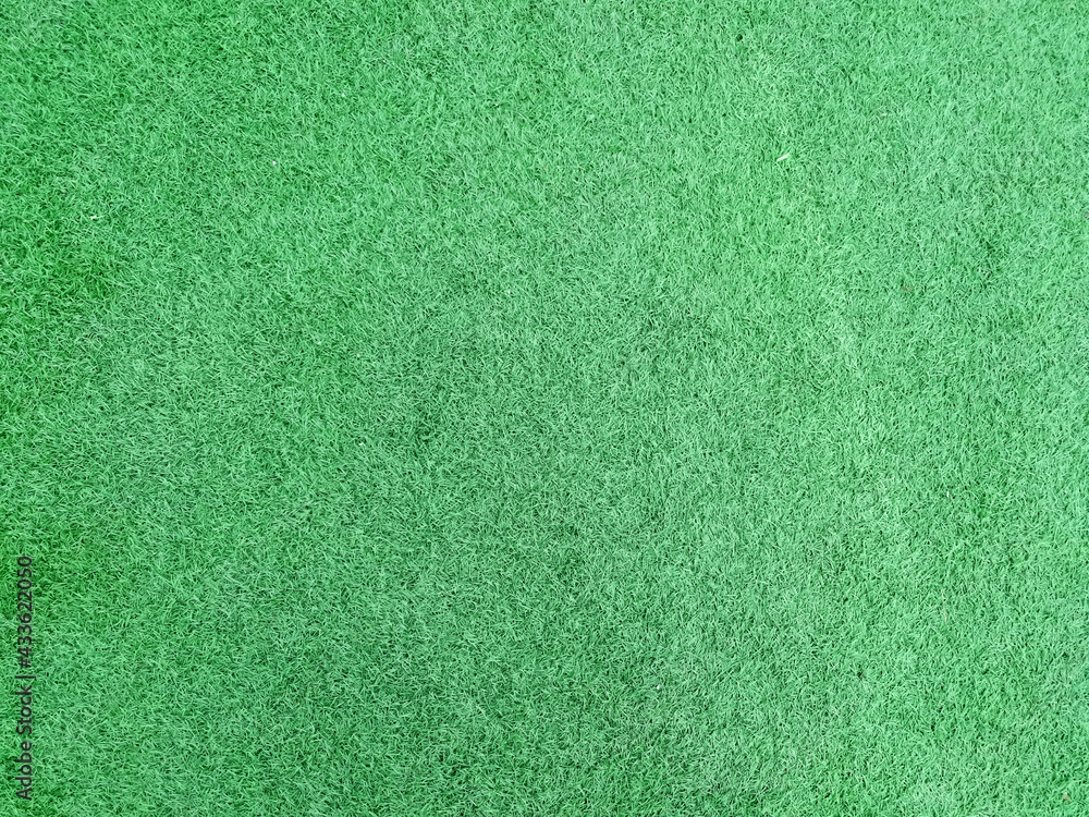 Lush artificial turf in football field top view