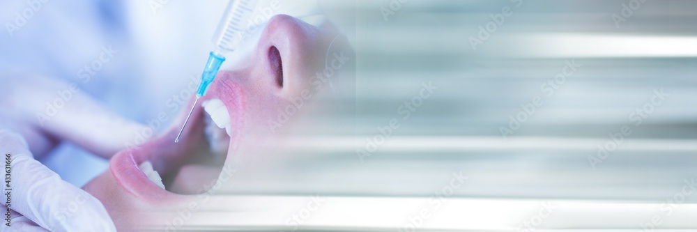 Composition of close up of female patient receiving local anaesthetics with blurred light trails