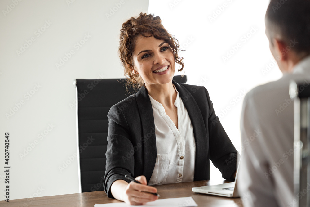 Close-up portrait of a happy executive on a meeting.