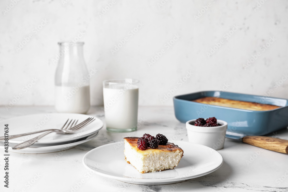 Plate with piece of cottage cheese casserole on table