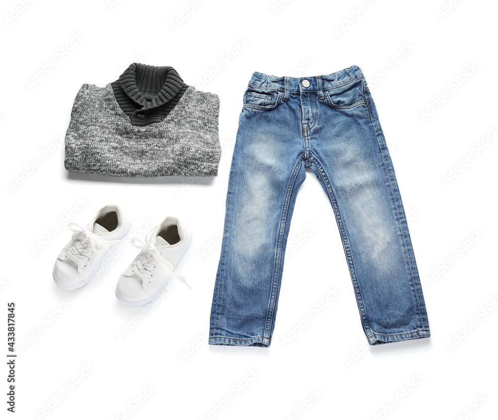 Childs clothes and shoes on white background