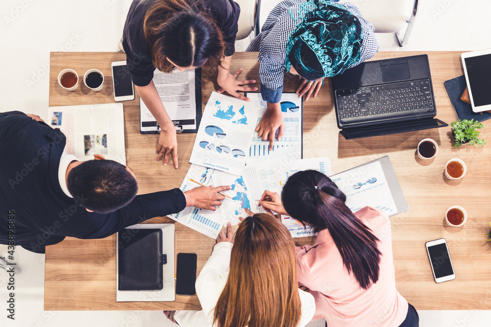 Top view of businessman executive in group meeting with other businessmen and businesswomen in moder