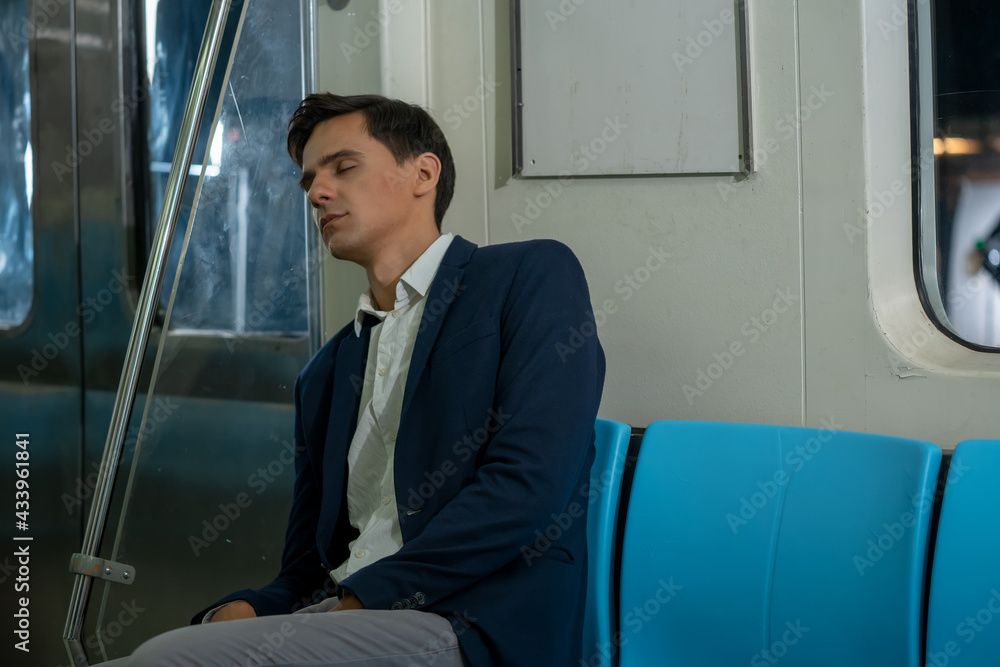 Business people sleeping on subway while traveling to work at city.