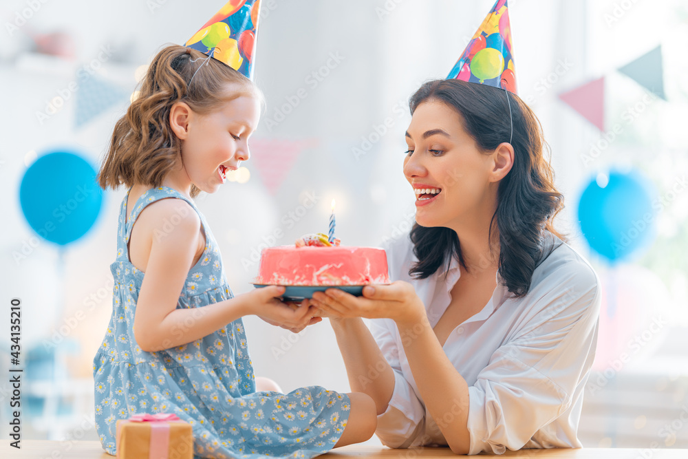 Mother and daughter are celebrating birthday.