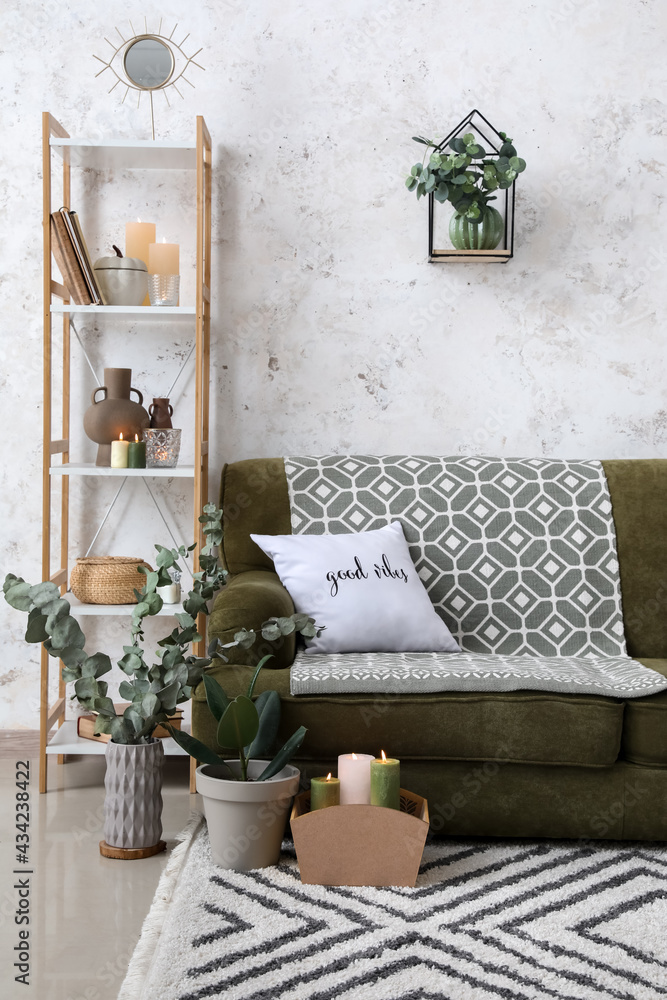 Stylish interior of living room with burning candles