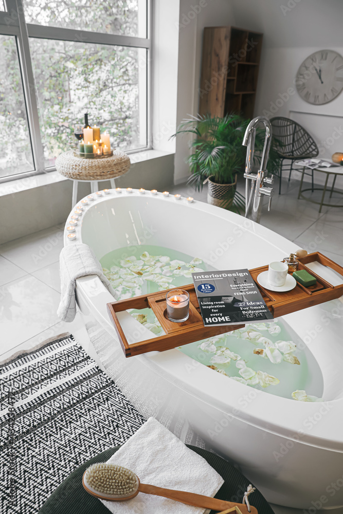 Stylish interior of modern bathroom with burning candles