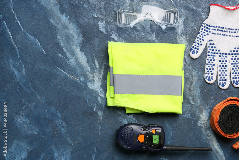 Safety equipment on color background