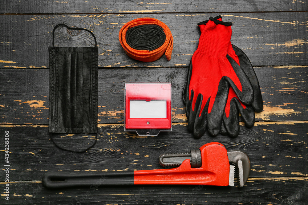 Safety equipment on dark wooden background