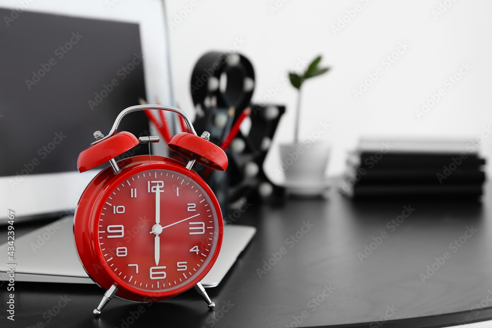 Alarm clock on table in room