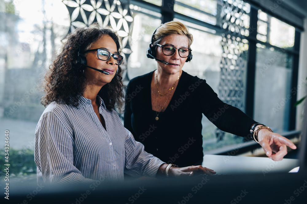 Business women working together in office