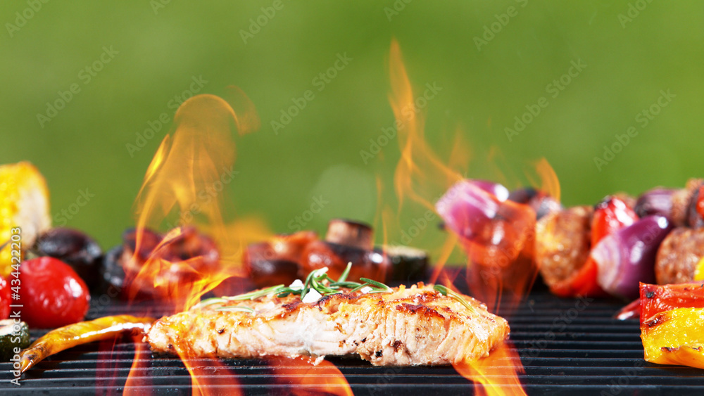 Delicious grilled salmon steak placed on barbecue grill.