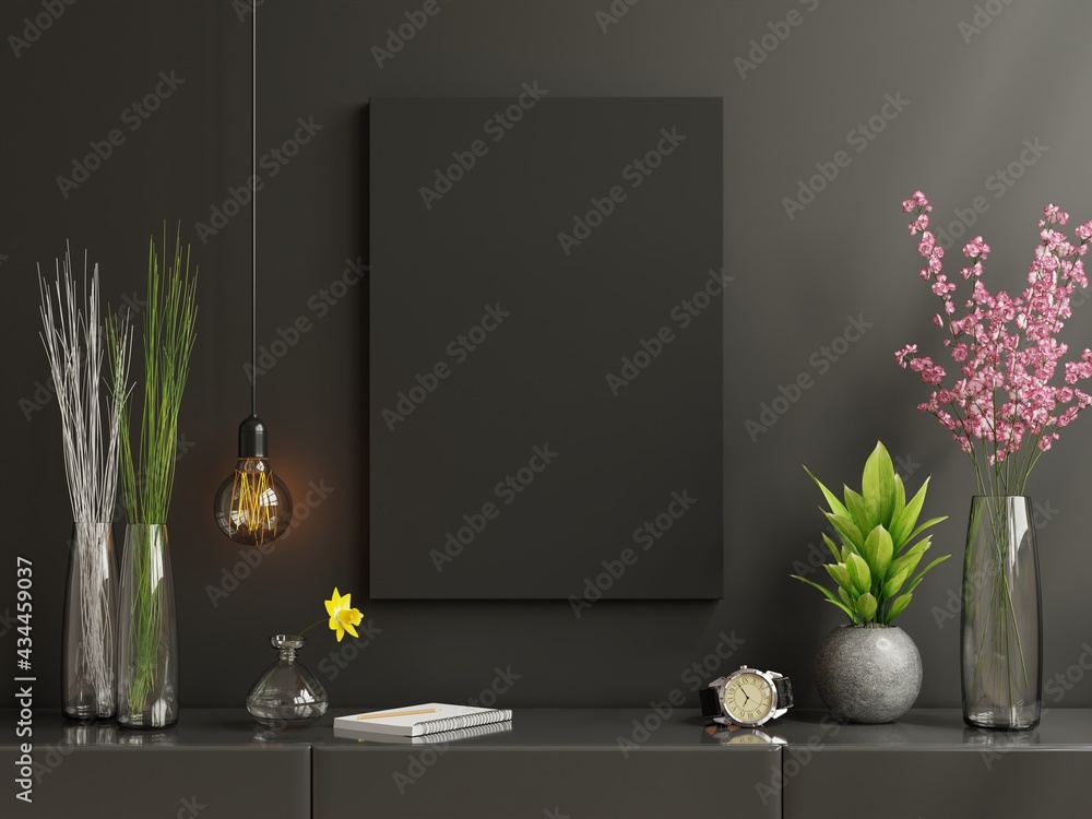 Mockup black poster frame on cabinet in living room interior on empty dark black wall background.