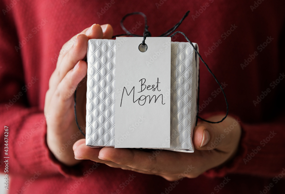 Woman holding present for her mom