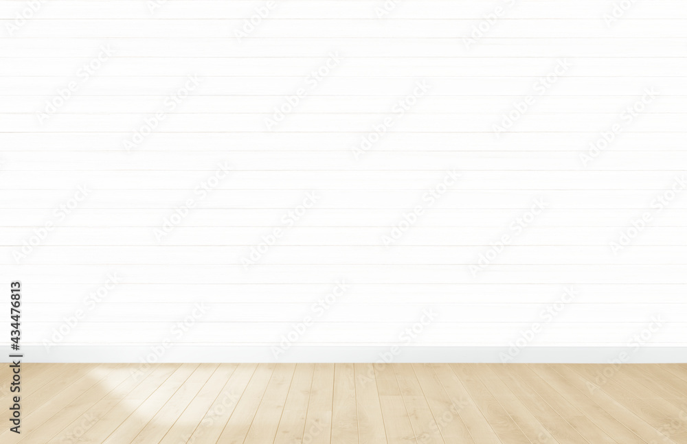 White wallpaper in an empty room with wooden floor