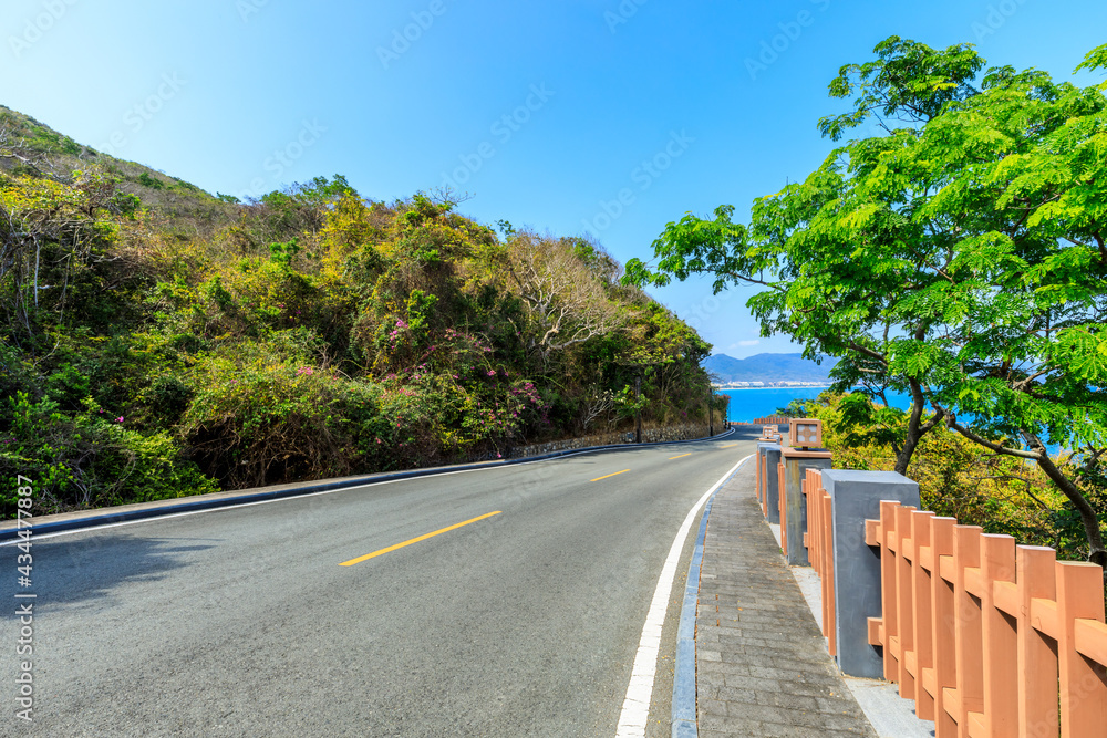 Asphalt highway go aside the bay of ocean.