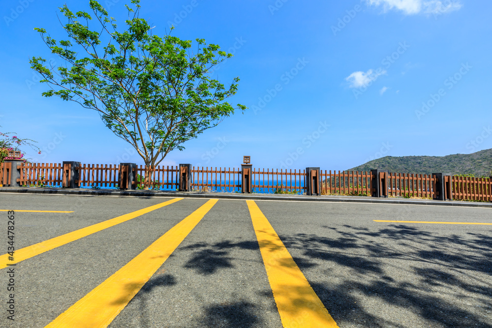 Asphalt highway go aside the bay of ocean.