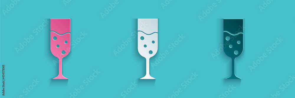 Paper cut Glass of champagne icon isolated on blue background. Paper art style. Vector