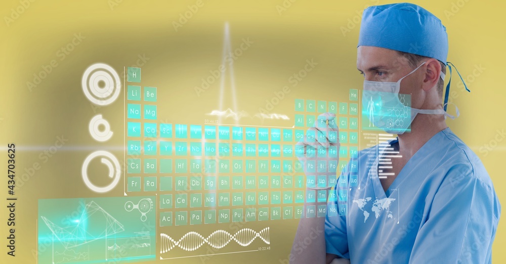 Periodic table and medical data processing over thoughtful male surgeon wearing face mask