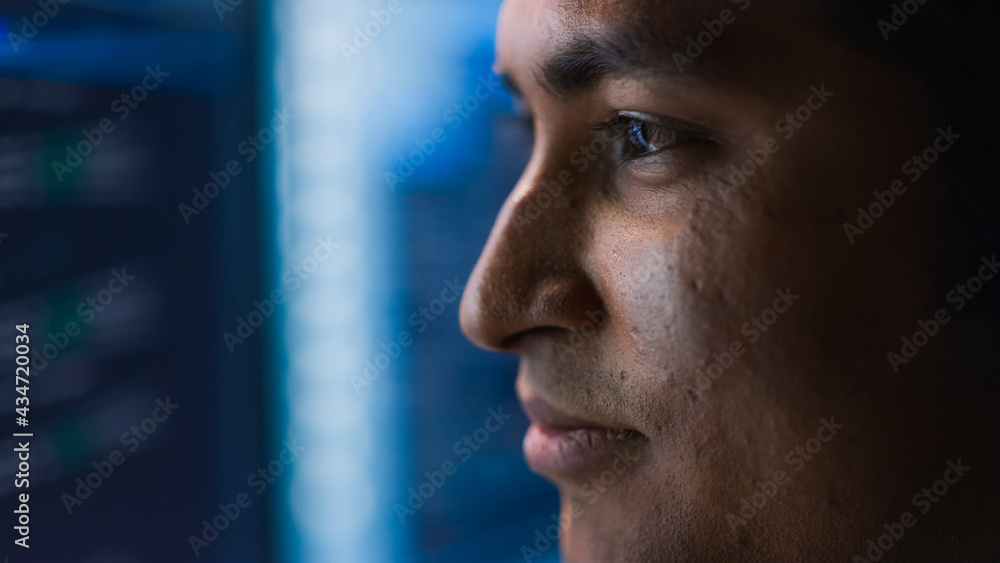 Confident Handsome Man Looks at Monitor Screen Focused. Professional Businessman Thinking Hard While