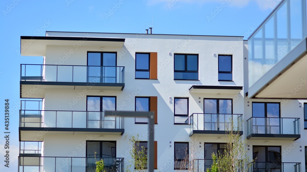 Condominium and apartment building with  symmetrical modern architecture in the city downtown.