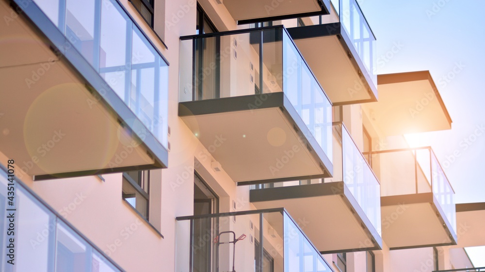 Condominium and apartment building with  symmetrical modern architecture in the city downtown.