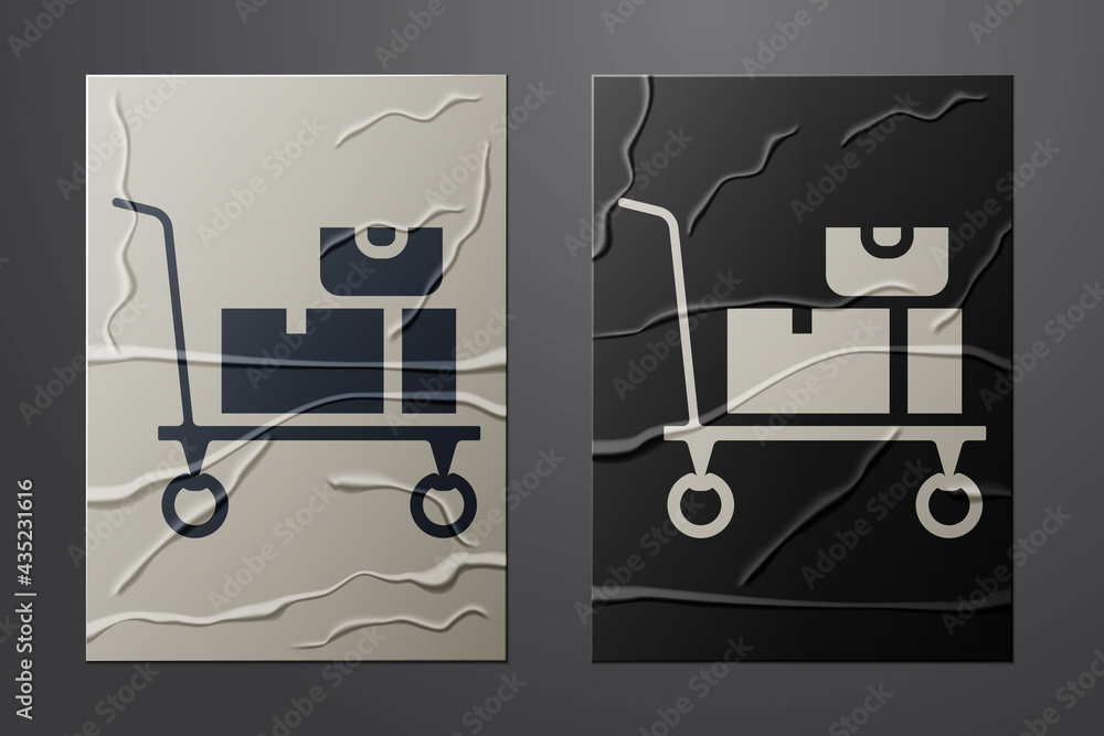 White Hand truck and boxes icon isolated on crumpled paper background. Dolly symbol. Paper art style