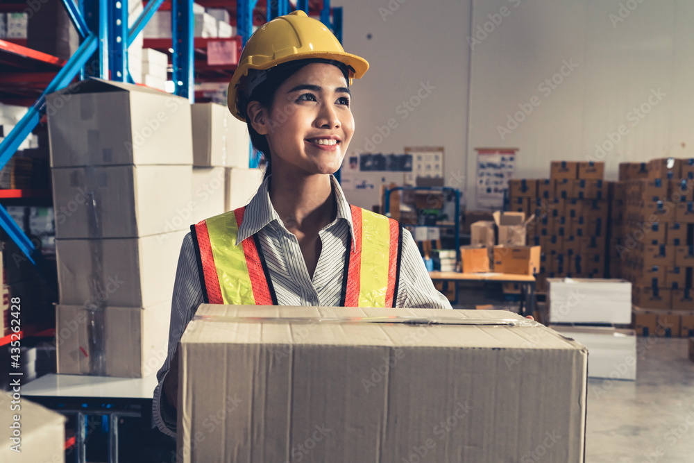 Female warehouse worker working at the storehouse . Logistics , supply chain and warehouse business 